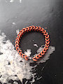 black and orange rubber band bracelet