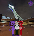 A three-way photo in front of Montreal's Olympic Tower